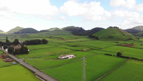 4k-aerial-drone-footage-panning-the-landscape-of-the-beautifully-luscious-green-farming-fields-of-Portugal's-Azores