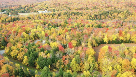Aerial-view-of-colorful-autumn-landscape-in-rural-american-countryside-on-sunny-day,-drone-shot