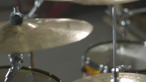 Close-up-of-cymbal-on-drum-kit-being-hit-in-slow-motion