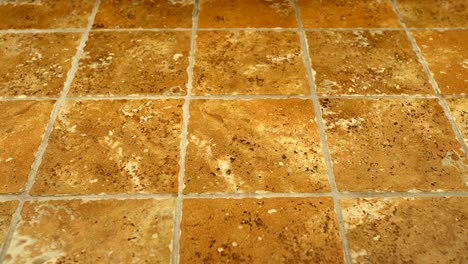 Installed-ceramic-floor-tiles---brown-and-yellowish-textures