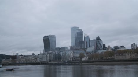 Central-London-skyscrapers-on-a-cloudy-rain-day-reflected-in-the-Thames-river