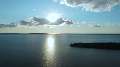 Aerial-shot-of-a-sunset-over-a-large-lake-in-northern-Quebec-province