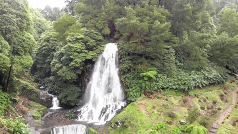 Beautiful-waterfall-and-cascade-surrounded-by-luxuriant-vegetation-,-Azores,-Portugal