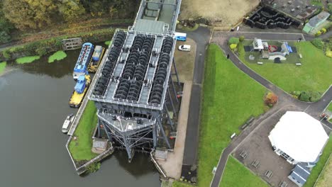 Industrial-Victorian-Anderton-canal-boat-lift-Aerial-view-River-Weaver-birdseye-orbit-right-over-top