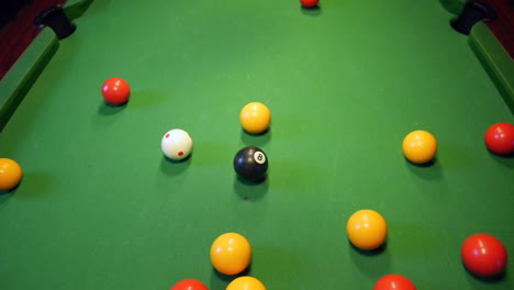 Pool-balls-racked-in-a-triangle-are-struck-by-the-white-ball