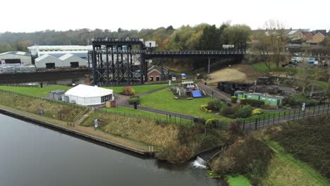 Industrial-Victorian-Anderton-canal-boat-lift-Aerial-view-River-Weaver-pull-away-tilt-up