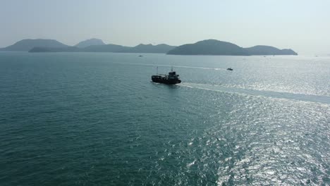 Aerial-footage-of-a-Cargo-ship-cruising-in-Hong-Kong-bay