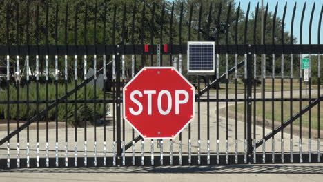 Large-solar-powered-flashing-STOP-sign-halts-traffic-at-security-gate----4K
