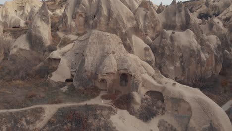 Circling,-4k-aerial-drone-footage-of-the-cone-shaped-formations-in-Cappadocia-of-central-Turkey