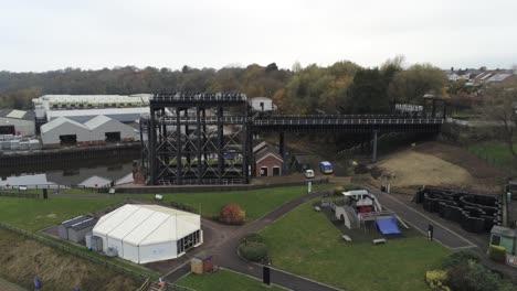 Industrial-Victorian-Anderton-canal-boat-lift-Aerial-view-River-Weaver-wide-tilt-down-rising-over
