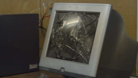 Old-computer-monitor-being-smashed-with-crowbar---slowmotion