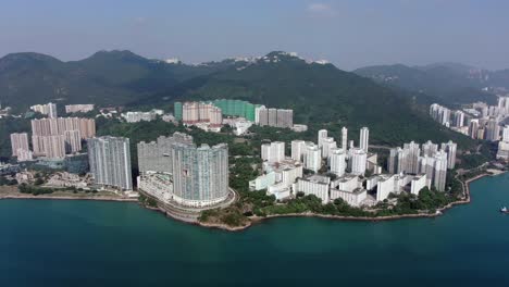 Hong-Kong-Cyberport-waterfront-park-luxury-residential-buildings,-Aerial-view
