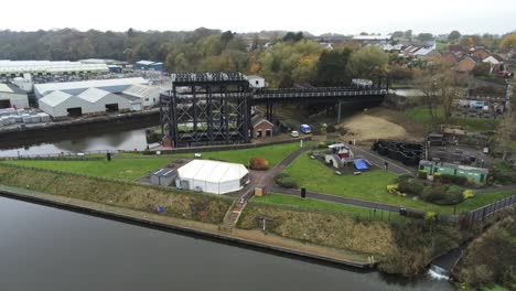Industrial-Victorian-Anderton-canal-boat-lift-Aerial-view-River-Weaver-mid-push-in-shot