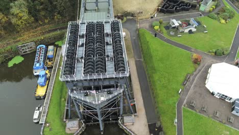 Industrial-Victorian-Anderton-canal-boat-lift-Aerial-view-River-Weaver-rising-birdseye-tilt-down