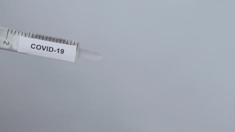 Doctor's-Hand-Putting-Needle-On-Syringe-For-Covid-19-Vaccine,-Close-Up