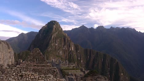 Slow-Follow-Shot-Right-Across-Machu-Picchu-ancient-inca-city-in-Peru,-South-America