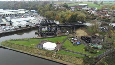 Industrial-Victorian-Anderton-canal-boat-lift-Aerial-view-River-Weaver-high-descending-shot
