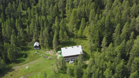 Mountain-hut-in-the-middle-of-Alps-Peca-forest