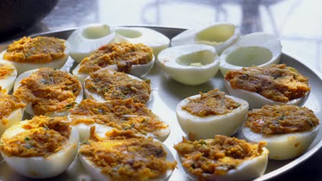 filling-eggs-stuffing-boiled-egg-plate-full-mom-cooking-homemade-Deviled-egg-also-known-as-stuffed-eggs,-Russian-eggs,-or-dressed-eggs