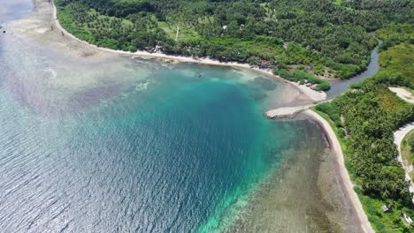 Stunning-aerial-view-of-a-cost-of-Philippines-in-Negros-Oriental,-with-Paradise-lagoon-in-tropical-scenery