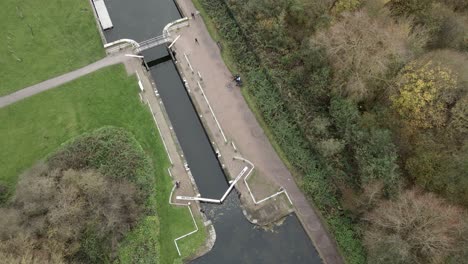 Canal-Lock-drone-rising-overhead-point-of-view-4K-footage