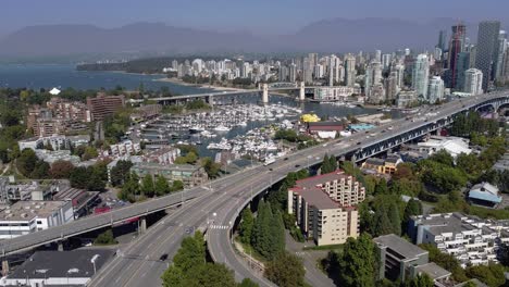 2-4-Aerial-panout-over-Upper-Granville-Island-residential-commercial-community-and-bridge-leading-downtown-over-the-False-Creek-yacht-parked-boating-clubs-on-a-lush-summer-lockdown-pandemic-afternoon