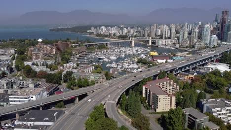 4-4-Aerial-panout-over-Upper-Granville-Island-residential-commercial-community-and-bridge-leading-downtown-over-the-False-Creek-yacht-parked-boating-clubs-on-a-lush-summer-lockdown-pandemic-afternoon