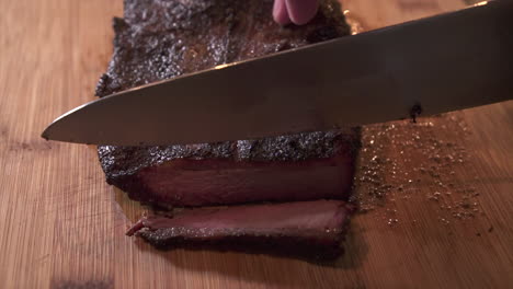 Slicing-a-juicy-piece-of-smoked-flat-cut-beef-brisket