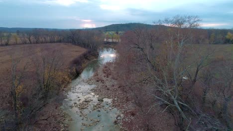 Aerial-shot-over-Cedar-Creek-on-Monterey-toward-the-Kentucky-river,-beautiful-fall-scenery-and-clouds-reflecting-off-of-the-pristine-water