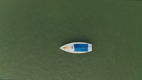 Seafront-solitary-boat-topdown-view-DJI-Mavic-2-Pro