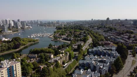 2-4-Aerial-panaramic-fly-over-Granville-Island-False-Creek-Residential-commercial-luxury-modern-lowrise-community-by-the-yacht-clubs-and-the-lush-green-parks-in-downtown-Vancouver-Canada-East-View