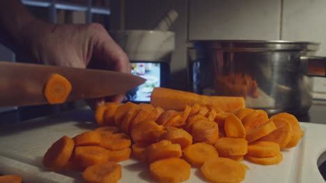 Chopping-carrots-for-online-cooking-tutorial-on-mobile-device