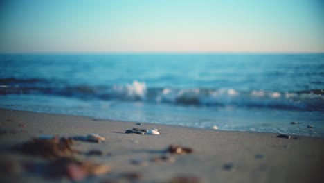 Ocean-waves-at-a-sandy-beach-with-blurred-background