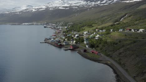 Idyllic-Iceland-village-Eskifjordur-on-shore-of-beautiful-fjord,-aerial