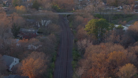 Aerial-pull-back-over-train-tracks-through-Kirkwood-in-St