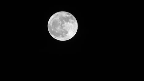 Bright-full-moon-crosses-night-sky-time-lapse----4K