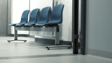 Empty-waiting-room-in-hospital,-no-patients-in-hospital-waiting-room---pan-video