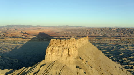 High-above-drone-aerial-footage-of-Factory-Butte-rock-formations-in-Utah