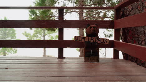 Bear-Statue-with-a-sign-that-says-"Wipe-Ur-Paws"-on-a-Cold-Winter's-Day