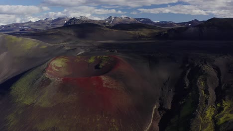 Scenery-Of-Red-Volcanic-Craters-In-Raudaskal,-Southern-Iceland,-Panning-Drone-Shot