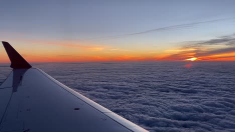 Dawn-on-a-plane,-over-left-wing