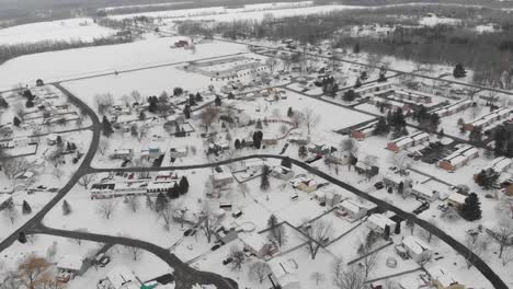 Aerial-View-Of-Tract-Housing-Covered-With-Snow-During-Winter-At-Hamlin,-Monroe,-New-York,-USA
