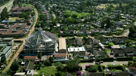 Aerial-top-down-over-suburb-district-of-Nairobi-with-church-during-sunny-day