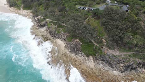 Ocean-Waves-Crashing-At-Cylinder-Headland-Foreshore---Coastal-Walk-Near-Cylinder-Beach-In-Point-Lookout,-North-Stradbroke-Island,-QLD,-Australia