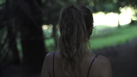 Inspiring-young-latin-female-walking-thought-pine-forest-Slow-motion-60-fps