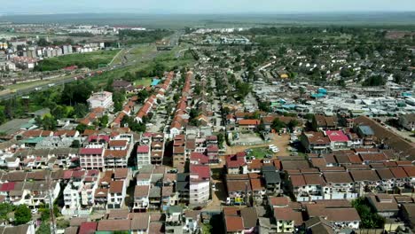 Aerial-view-of-wealthy-district-bordering-urban-slums-area-in-Nairobi-during-beautiful-sunny-day