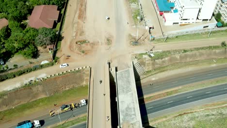 Aerial-top-down-of-old-bridge-with-direction-to-the-slums-district-in-Kibera,Nairobi