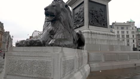 Slow-motion-shot-showing-in-detail-the-famous,-iconic,-lion-statue-from-Trafalgar-Square,-London