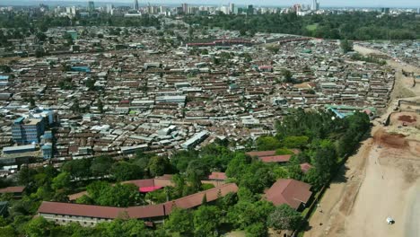 Aerial-view-of-large-Kibera-Slum-District-and-developed-city-of-Nairobi-in-background