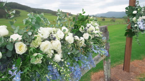 Blossoming-White-Roses-Flower-Decorated-On-Outdoor-Countryside-Wedding